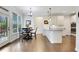 Open kitchen with granite countertops, white cabinetry, and stainless steel appliances at 1803 Stone Bridge Way, Marietta, GA 30064
