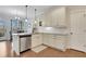 Bright kitchen features granite countertops, stainless steel appliances, and a kitchen island at 1803 Stone Bridge Way, Marietta, GA 30064