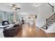 Open-concept living room with hardwood floors, ample seating, and access to the kitchen at 1803 Stone Bridge Way, Marietta, GA 30064
