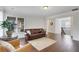 Open-concept living room with hardwood floors and recessed lighting at 1803 Stone Bridge Way, Marietta, GA 30064