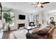 Cozy living room with a fireplace, large windows, and comfortable seating, perfect for relaxing at 1803 Stone Bridge Way, Marietta, GA 30064