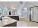 Main bathroom features double sinks, soaking tub, a separate glass shower, and granite counters at 1803 Stone Bridge Way, Marietta, GA 30064