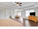 Large main bedroom with hardwood floors, ceiling fan, and adjoining sitting room at 1803 Stone Bridge Way, Marietta, GA 30064