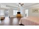 Main bedroom boasts hardwood floors, tray ceiling, ceiling fan, and lots of natural light at 1803 Stone Bridge Way, Marietta, GA 30064