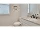 Clean powder room with granite countertop, white cabinets, and neutral decor at 1803 Stone Bridge Way, Marietta, GA 30064