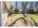 Expansive backyard featuring mature trees, lush grass, and ample space for outdoor activities at 2131 Columbia Dr, Decatur, GA 30032