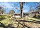 A tree shades the home's backyard, creating a beautiful outdoor space at 2131 Columbia Dr, Decatur, GA 30032