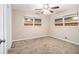 This cozy bedroom features neutral walls, two windows, and ceiling fan at 2131 Columbia Dr, Decatur, GA 30032