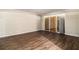Spacious living room featuring laminate floors and a brick accent wall at 2131 Columbia Dr, Decatur, GA 30032