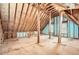Spacious unfinished attic with exposed wood beams and visible insulation at 2290 Dragonfly Nw Ct, Acworth, GA 30101