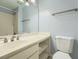 Well-lit bathroom with a white vanity, silver fixtures, and combined shower and tub at 2290 Dragonfly Nw Ct, Acworth, GA 30101
