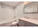 Bathroom featuring tub-shower combination and single sink vanity with gray cabinets at 2290 Dragonfly Nw Ct, Acworth, GA 30101