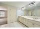 Bathroom featuring double vanity sinks and tile flooring at 2290 Dragonfly Nw Ct, Acworth, GA 30101