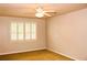 Neutral bedroom with light carpet, ceiling fan, and window shutters at 2290 Dragonfly Nw Ct, Acworth, GA 30101