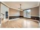 Elegant dining room featuring two-tone paint, hardwood floors, and natural light, ideal for memorable gatherings at 2290 Dragonfly Nw Ct, Acworth, GA 30101