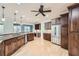 Gourmet kitchen with dark wood cabinets, stainless steel appliances, granite countertops, and spacious island with seating at 2290 Dragonfly Nw Ct, Acworth, GA 30101