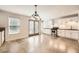 Open-concept kitchen and dining area with stainless steel appliances and concrete floors at 2290 Dragonfly Nw Ct, Acworth, GA 30101