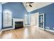 Spacious living room with fireplace, hardwood floors, and french doors at 2290 Dragonfly Nw Ct, Acworth, GA 30101