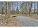 Scenic walking path through wooded area with small wooden bridge for residents to enjoy at 2290 Dragonfly Nw Ct, Acworth, GA 30101