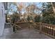 A spacious patio area showcases secure wooden railings and stairs leading to the yard and home at 2430 Hanford Sw Dr, Atlanta, GA 30315