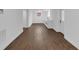Bright basement featuring modern white cabinets, sleek hardware, and attractive dark hardwood flooring at 2430 Hanford Sw Dr, Atlanta, GA 30315