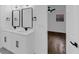 A modern bathroom features double sinks and mirrors with updated fixtures at 2430 Hanford Sw Dr, Atlanta, GA 30315