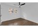 Cozy bedroom with hardwood floors, a modern ceiling fan, and a bright window at 2430 Hanford Sw Dr, Atlanta, GA 30315