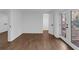 This bedroom features hardwood floors, an en suite bathroom, and natural light from the outdoor patio at 2430 Hanford Sw Dr, Atlanta, GA 30315
