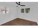 A bright bedroom features hardwood floors, natural light, and a ceiling fan at 2430 Hanford Sw Dr, Atlanta, GA 30315