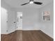 Bright bedroom leads into bathroom with tiled shower, hardwood floors and modern fan at 2430 Hanford Sw Dr, Atlanta, GA 30315