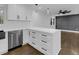 Bright kitchen featuring stainless steel appliances, white cabinetry and lots of counter space at 2430 Hanford Sw Dr, Atlanta, GA 30315