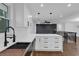 Modern kitchen with white cabinets, quartz countertops, and stainless steel appliances at 2430 Hanford Sw Dr, Atlanta, GA 30315