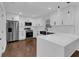 Well-lit kitchen with stainless steel appliances and a large quartz countertop island at 2430 Hanford Sw Dr, Atlanta, GA 30315
