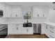 Well-lit kitchen showcases white cabinets, stainless steel appliances, and a dark sink at 2430 Hanford Sw Dr, Atlanta, GA 30315