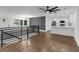 Open-concept layout featuring a modern kitchen and living room area with hardwood floors at 2430 Hanford Sw Dr, Atlanta, GA 30315