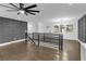Open living room with hardwood floors and large ceiling fan at 2430 Hanford Sw Dr, Atlanta, GA 30315