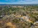 Scenic aerial view of a residential neighborhood nestled among lush trees and greenery at 210 Barrett Springs Way, Canton, GA 30115