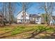 Wide shot of the backyard with playset and seating area at 210 Barrett Springs Way, Canton, GA 30115