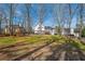 Large backyard with playset, fire pit and home at 210 Barrett Springs Way, Canton, GA 30115