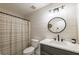 Charming bathroom featuring shiplap walls, modern fixtures and a striped shower curtain at 210 Barrett Springs Way, Canton, GA 30115