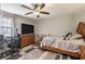 Spacious bedroom with a work area, storage, and comfortable sleeping space at 210 Barrett Springs Way, Canton, GA 30115