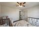 Neutral bedroom with a ceiling fan, plush rug and modern decor at 210 Barrett Springs Way, Canton, GA 30115