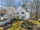 Attractive two-story home featuring a well-manicured lawn with garden, perfect for outdoor enjoyment at 210 Barrett Springs Way, Canton, GA 30115
