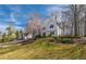 Charming two-story home with manicured lawn, showcasing its curb appeal in a well-maintained neighborhood at 210 Barrett Springs Way, Canton, GA 30115