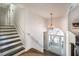 Bright entry foyer with hardwood floors, staircase and chandelier at 210 Barrett Springs Way, Canton, GA 30115