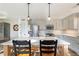 Well-lit kitchen with stainless steel appliances, pantry, and ample counter space at 210 Barrett Springs Way, Canton, GA 30115