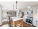 Modern kitchen with an island and stainless steel appliances at 210 Barrett Springs Way, Canton, GA 30115
