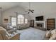 Bright living room with vaulted ceiling, stone fireplace, and neutral decor at 210 Barrett Springs Way, Canton, GA 30115