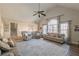Airy living area boasts a high ceiling, large windows, and comfortable seating at 210 Barrett Springs Way, Canton, GA 30115