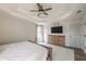 Spacious main bedroom with a tray ceiling, a wooden dresser, and a ceiling fan at 210 Barrett Springs Way, Canton, GA 30115